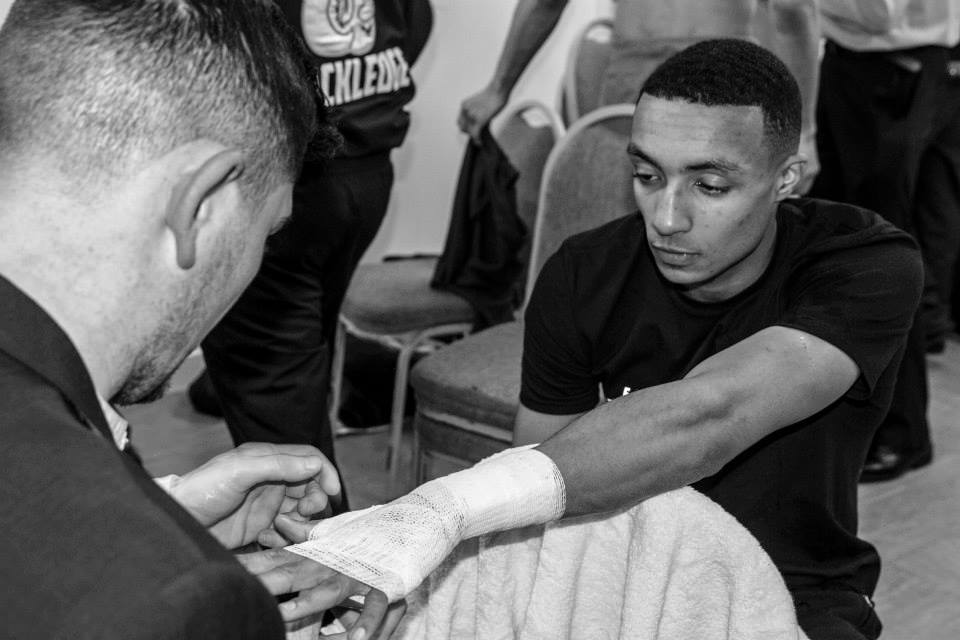 Zelfa Barrett hands wrapped off Michael Jennings