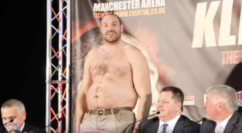 tyson fury takes off top at press conference fat